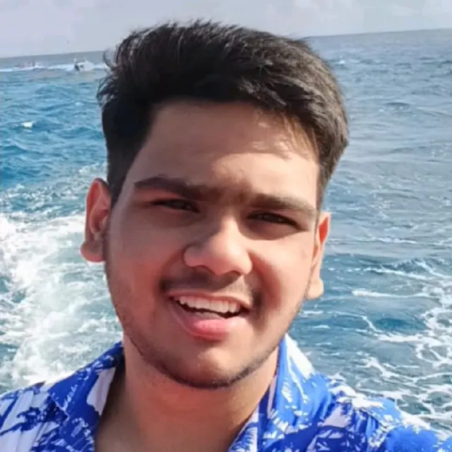 Portrait of Abhinav Anand smiling on a boat at sea